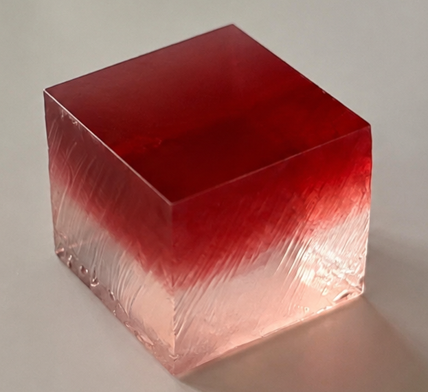 Close-up of a handcrafted Rose Botanical Jelly featuring a rose-red gradient.