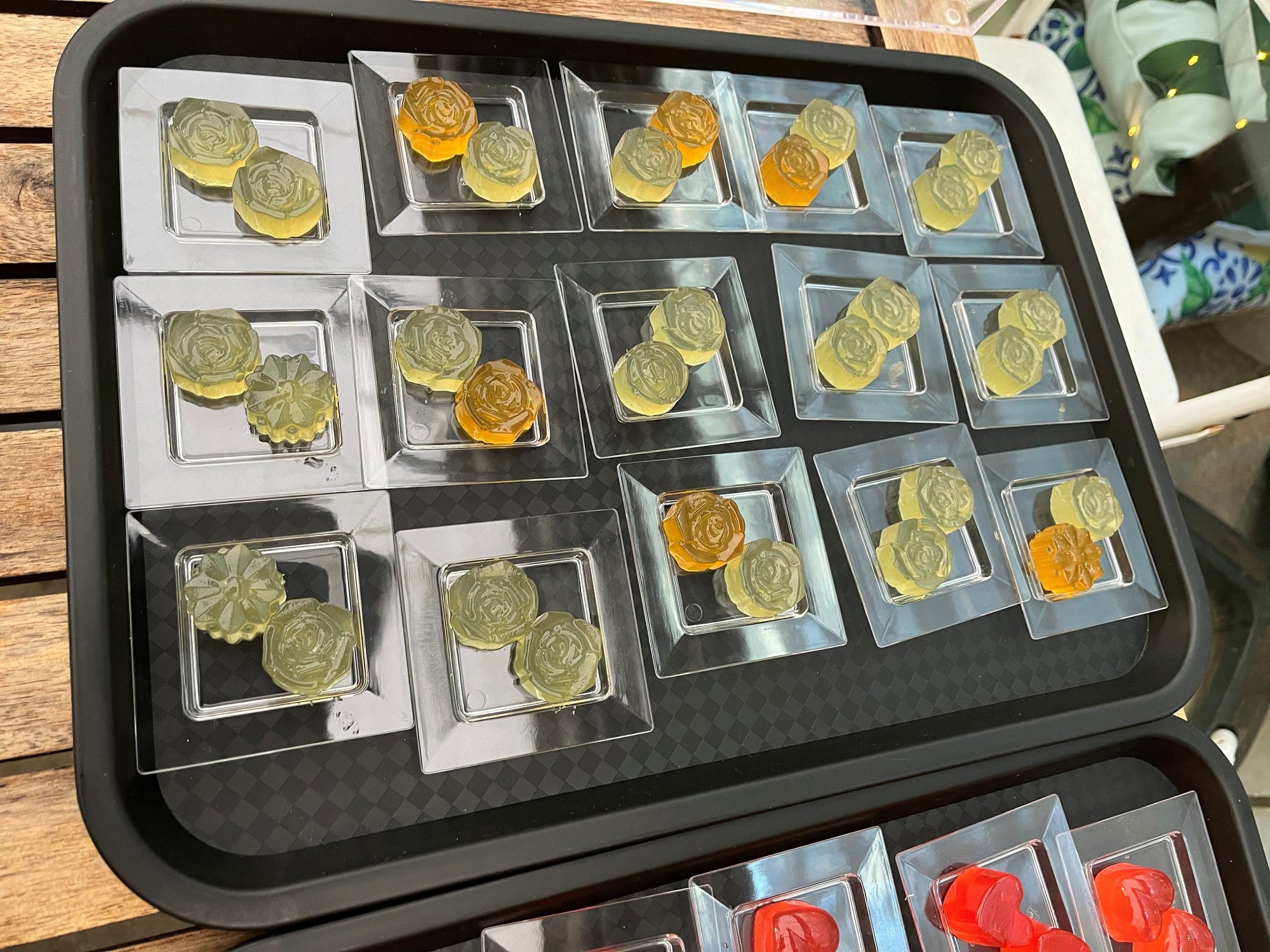 YIXO - a tray of mojito jellies in the shape of flowers