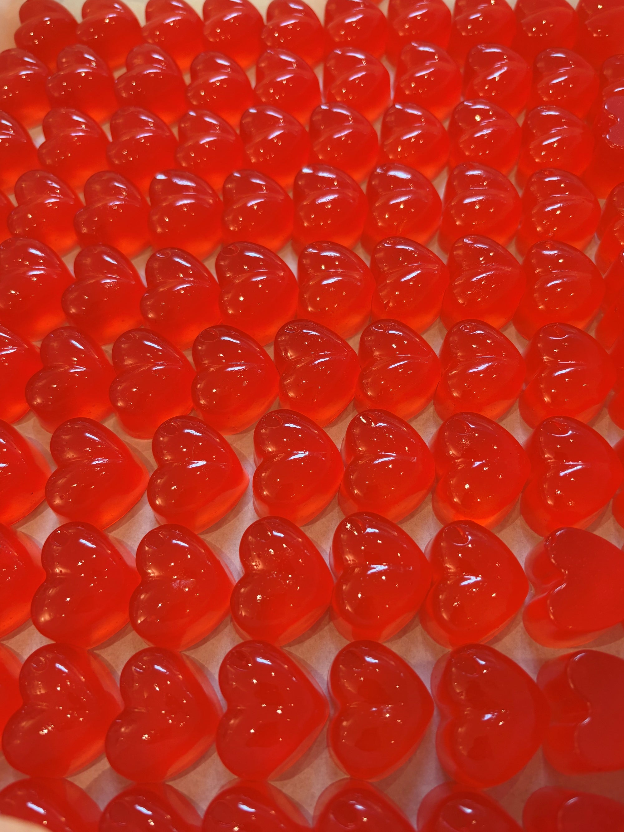 Lots of heart shaped vegan watermelon & vodka jellies
